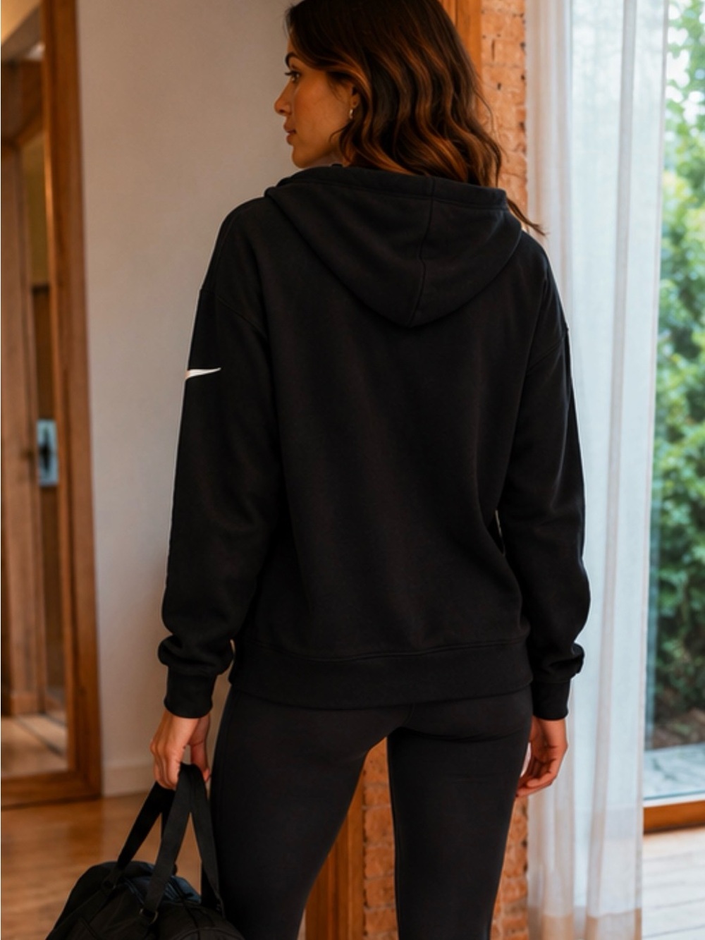 Nike Black Hoodie with White Swoosh on Sleeve